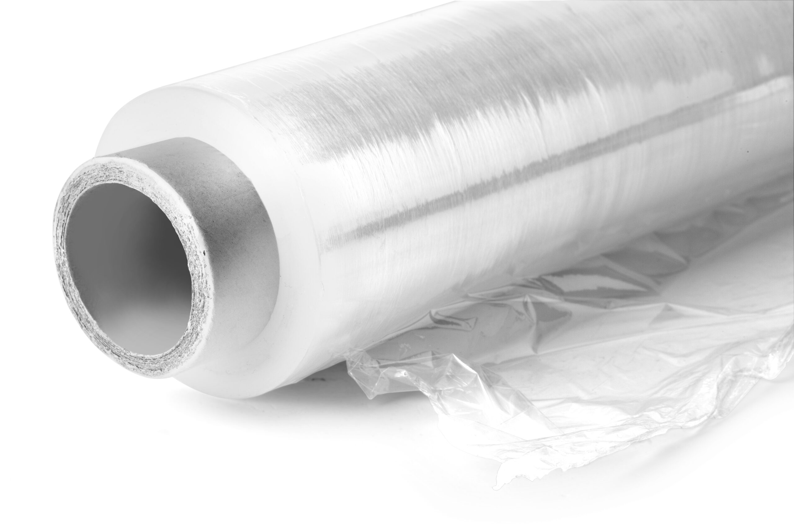 Roll of wrapping plastic stretch film. Close-up. Isolated on white background. With clipping path